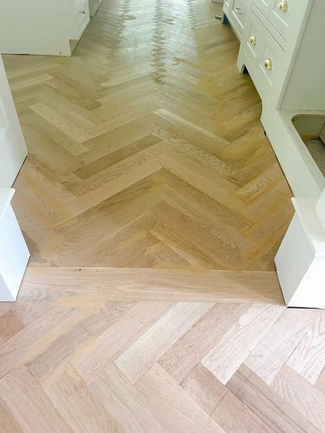 Sharing our white oak in a herringbone wood floor pattern we just installed! Discussing cost, where to put them, and what direction to lay the herringbone. Tiled Herringbone Floor, White Oak Herringbone Floor Kitchen, Herringbone Wood Hallway, Lvp Flooring Chevron, Fishbone Tiles Floor, White Oak Chevron Floor, Herringbone Wood Look Tile Floor, Herringbone Wood Floor Transition, Wood Look Herringbone Tile Floor