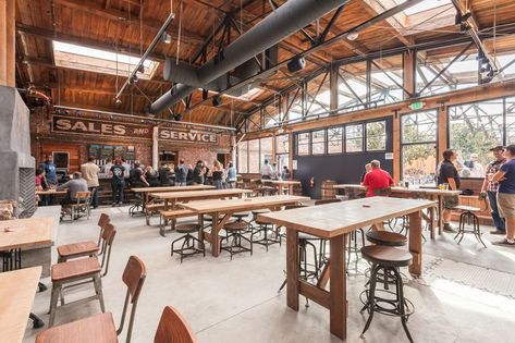 Drake's Dealership Is Now Open, Featuring a Huge Beer Garden, Pizzas and More - Eater SF Industrial Restaurant Design Interiors, Cubano Pizza, Pub Concept, Taproom Design, Taproom Ideas, Beer Garden Design, Barn Restaurant, Coffee Shop Counter, Brewery Taproom