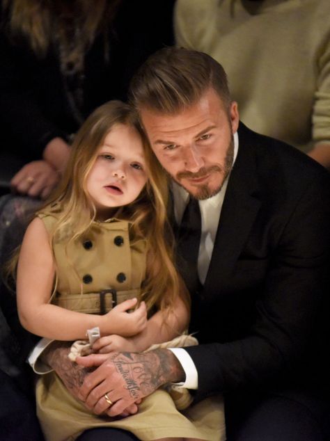 Could this family get any more beautiful? See more from the Beckhams' front row outing at Burberry's LA show. (Harper's style is especially on point!) The Beckham Family, Harper Beckham, Victoria And David, David And Victoria Beckham, Brooklyn Beckham, Celebrity Families, Celebrity Kids, Dad Daughter, Burberry London