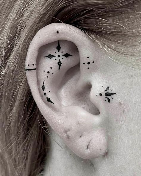 ear tattoo of an ornamental pattern Celtic Ear Tattoo, Cover Up Tattoo Behind Ear, Small Face Tattoos For Women By Ear, Viking Ear Tattoo, First Tattoo Designs, Ear Lobe Tattoo, Inside Ear Tattoos, Sideburn Tattoo, Pink Flower Tattoos