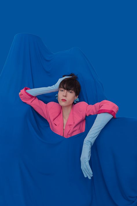 Conceptual Editorial Photography by Alexandra Diona. Woman in Fuschia Coat with light blue gloves inside a blue background. Pink And Blue Photoshoot, Colored Photoshoot, Blue Photoshoot Ideas, Blue Photoshoot Aesthetic, Blue Model Photography, Colorblock Photoshoot, Electric Blue Moodboard, Photoshoot Blue Background, Blue Background Photoshoot