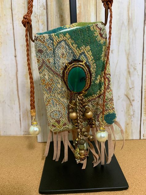 "Sale: One of a kind handmade Bohemian Crossbody small bag made with upcycled upholstery fabric and recycled jewelry pieces.   This crossbody bag is perfect for concerts or any event when you want your hands free.  A unique adjustable crossbody bag with a traditional upholstery fabric in greens and brown color scheme, a green agate centerpiece and gold metal chain and bead adornment on the front, faux suede fringe, and an adjustable crossbody or shoulder strap made of a braided belt with pearls Traditional Upholstery, Boho Chic Bags, Brown Color Schemes, Boho Items, Upcycled Bag, Tapestry Bag, Small Boho, Braided Belt, Black Leather Wallet