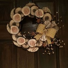 how to make a winter wreath from wood slices, crafts, seasonal holiday decor, wreaths, Front door wreath Fall Wood Slice Wreath, Winter Wood Crafts, Neighborhood Park, Winter Wreath Diy, Wood Wreath, Wooden Wreaths, Winter Wood, Wreath Diy, Wood Crafts Diy