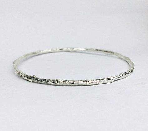 This listing is for a sterling silver 925 bangle bracelet was cast using a real branch.SIZESSmall - 2 3/8 in. inner diameterMedium - 2 1/2 in. inner diameterLarge - 2 5/8 in. inner diameterExtra Large - up to 3 inches inner diameterDIMENSIONS: 3 mm (8/64 in.) diameter of branchMATERIAL: sterling silver 925Don't forget to write your size in note to seller at checkout.In case you want a size different than the 3 adove please let me know.I can make it in any size you want.Every bangle is handmade a Silver Open Band Bangle With Polished Finish, Artistic Silver Bangle, Hand-wrapped Silver Braided Bangle Bracelet, Artisan Nickel-free Bangle, Twig Bracelet, Branch Bracelet, Bohemian Sterling Silver Nickel-free Bangle, Stackable Ring Sets, Minimal Ring