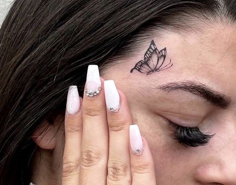 Cool Face Tattoos For Women, Face Tats Women, Butterfly Face Tattoos For Women, Small Face Tattoos For Women Under Eye, Tattoo Over Eyebrow, Sparkle Face Tattoo, Baddie Face Tattoos, Feminine Face Tattoo, Small Face Tattoos For Women