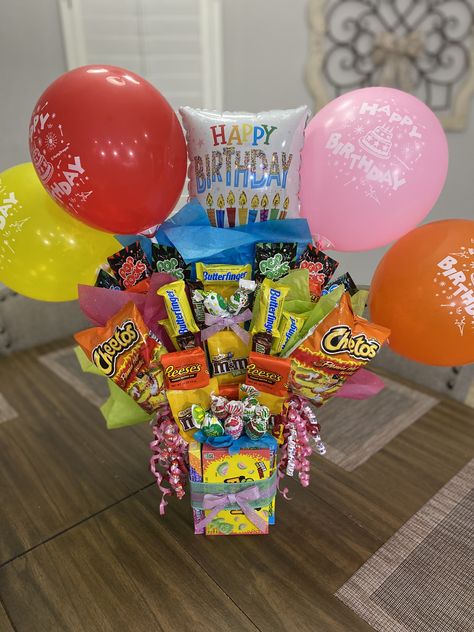 Dollar Tree materials. Glued on candies with wooden skewers Candy Bucket Ideas Gift Baskets, Diy Candy Birthday Gifts, Birthday Gifts From Dollar Tree, Candy Birthday Basket, Candy Baskets Ideas, Kids Candy Bouquets, Candy Birthday Gift Ideas, Dollar Tree Birthday Basket, Snack Birthday Gift Ideas