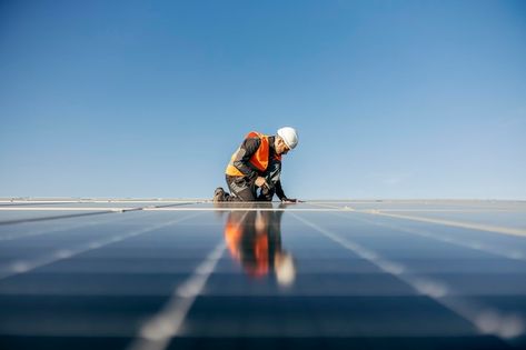 Photo worker kneeling and sets solar pan... | Premium Photo #Freepik #photo #photovoltaic #solar-panel #paneles-solares #solar Solar Panel Photography, Photo Moodboard, Between Two Worlds, Attract Customers, Photovoltaic Panels, Ganpati Decoration, Energy Management, Solar Installation, Solar Panel Installation