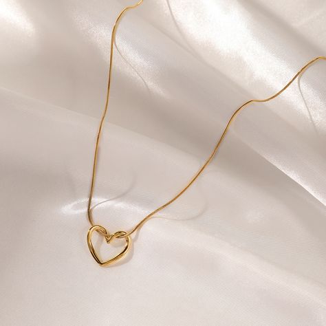 hollow heart gold plated necklace •Tarnish free •stainless steel •water-resistant dm for more information TheOnyx - share moments , share onyx #jewelry #accessories #jewellery #fashion #style #necklace #18kgoldplated #heartnecklace #theonyx #goldnecklace #goldaccessories #goldjewellery #fashionaccessories #fashionjewelry #lovefashion #lovejewelry [heartpendant, 18kgold ,goldplatedjewelery ,theonyx ,antitarnish] Initial Jewelry Necklace, Dainty Initial Necklace, Pretty Jewelry Necklaces, Heart Shaped Pendant Necklace, Gold Heart Necklace, Classy Jewelry, Jewelry Lookbook, Heart Shape Pendant, Initial Jewelry