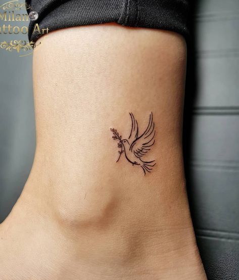 Pretty Dove Ankle Tattoo Idea Dainty Catholic Tattoos, Dainty Dove Tattoo, Dove Flying Tattoo, Angel Tattoo Placement, Dainty Christian Tattoos For Women, Dainty Ankle Tattoo, Small Biblical Tattoos, Biblical Tattoos For Women, Small Catholic Tattoos