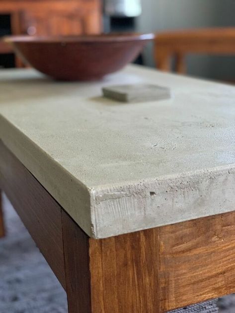 Stylish yet rugged, but beautiful coffee table in just a few steps!!Here is how I made my concrete coffee table, First make a mold out of milamin wood. The size is up to you. This one is 500mmx1000mmx45mm. Put silicone inside along the edges. Before pouring the concrete make sure that the mold is very clean and level. Then spray cooking spray inside the mold, or you can use olive oil, just to prevent the concrete from sticking to the mold. This is just to show the reinforcement I us… Concrete Top Console Table, Wood And Concrete Coffee Table, Cement Table Top Diy Outdoor, Diy Outdoor Concrete Coffee Table, Making A Concrete Table Top, Making A Table Top Wood, Concrete Desk Top, Concrete Top Coffee Table, Concrete Table Top Diy