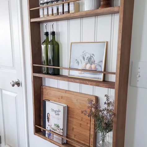 My favorite kitchen refresh project so far. Function and beauty all wrapped up into one. #kitchenrefresh #wallrack #spicerack #modernvintage #diy #doablediy #diyhome Cookbook Shelf Kitchen, Recipe Bookshelf In Kitchen, Wall Behind Kitchen Island, Recipe Book Shelf Kitchen, Cookbook Display Shelf, Cookbook Shelf In Kitchen, Cook Book Display Ideas, Cookbook Storage Shelf, Cookbook Wall