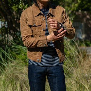 Waxed Trucker Jacket Outfit, Rugged Outerwear With Waxed Finish For Fall, Rugged Waxed Finish Outerwear For Fall, Winter Workwear Outerwear With Waxed Finish, Trucker Jacket Men Outfit, Tan Denim Jacket, Waxed Trucker Jacket, Trucker Jacket Outfit, Waxed Canvas Jacket