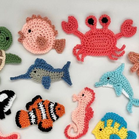 Katy Mitchell | Crochet Designer on Instagram: "Here is the whole collection of appliqués that will be on my new Sea Life Friends Blanket 🐠
I can’t wait to get them on their squares and see this design come together, I love it already! 🤩

Which is your favourite creature? 😍
I love so many of them, it’s so hard to choose!

#sealifefriendsblanket 
Pattern in progress ✍️

#crochetappliques #crochetapplique #crochetcreatures #crochetanimals #crochetseacreatures" Under The Sea Crochet Patterns, Crochet Shark Applique, Crochet Flat Animals, Crochet Background, Flat Crochet, Nautical Crochet, Sea Crochet, Friends Blanket, Crochet Sea Creatures