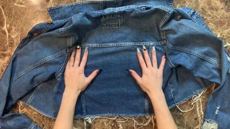 This is a guide to upcycled denim jacket ideas. Learn how to upcycle a denim jacket using just an old graphic t-shirt, using this simple step-by-step tutorial. Distressed Denim Jacket Diy, Diy Jacket Refashion, Denim Jacket Ideas, Upcycle Jean Jacket, Jean Jacket Diy, Recycle Old Clothes, Clothes Upcycle, Cut Out Jeans, Upcycled Denim Jacket