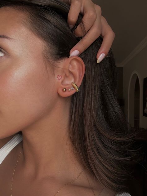 Minimal Tattoo Behind Ear, Ear Piercing Tattoo Ideas, Small Tattoos On Ear, Begging Ear Tattoo, Heart In Ear Tattoo, Mini Ear Tattoos, Behind The Ear Tattoo Heart, Front Of The Ear Tattoo Ideas, Tattoo Behind Ear Girl