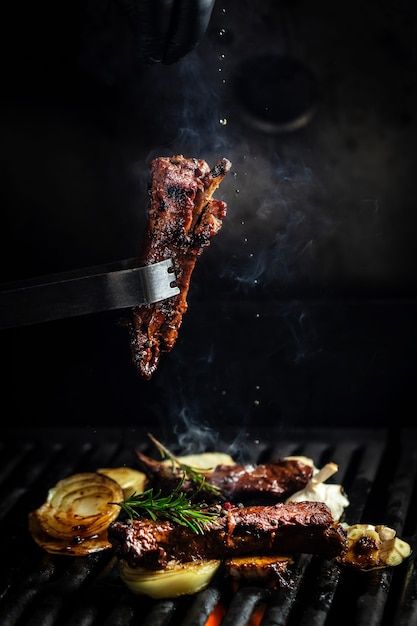 Premium Photo | Fork with pieces of delicious barbecued meat on black background Open Fire Cooking, Premium Meat, Sichuan Pepper, Food Photoshoot, Fire Grill, Hot And Spicy, Fire Cooking, Premium Food, Food Poster Design