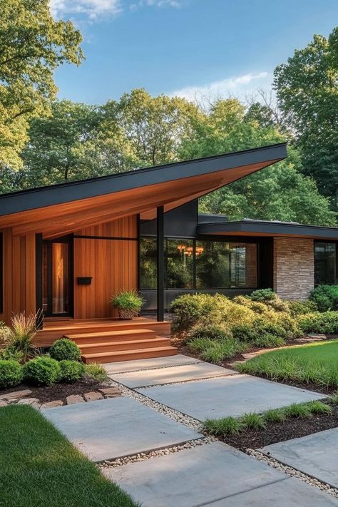 Mid century modern house front porch with natural wood siding. Check out all of these mid-century modern houses with curb appeal the envy of the neighborhood. Modern Front Yard Landscaping Ideas Mid Century, Mid Century Modern House Outside, Mid Century Front Porch Decor, Mid Century Modern New Construction, Tudor Mid Century Modern, Mcm Porch Ideas, La Mid Century House, Mid Century Stone Exterior, Mid Century Modern Outdoor Spaces