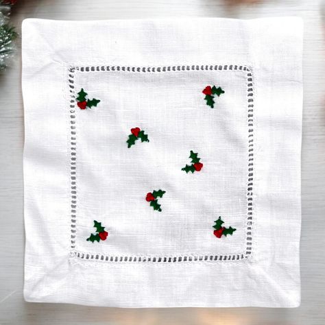 Set of four linen/cotton cocktail napkins, embroidered with Christmas Holly. Add festive charm to your holiday gatherings with these elegant napkins. Made of quality linen and cotton blend, each napkin features intricate embroidery of Christmas holly leaves and berries. Perfect for serving beverages and hors d'oeuvres during your Christmas parties or as a thoughtful gift for a loved one. #holidays #holidayseason #embroidery #etsy #shopsmall Holiday Party Table Setting, Branch Embroidery, Embroidered Cocktail Napkins, Christmas Cocktail Party, Winter Garland, Holiday Hostess Gifts, Embroidery Design Download, Napkin Design, Quick Stitch