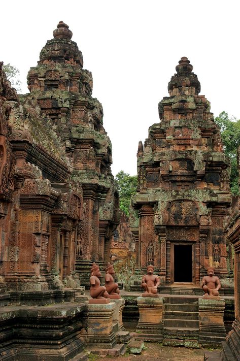 Banteay Srei (Banteay Srey)a 10th c.temple of Khmer architecture dedicated to the Hindu god Shiva.Angkor in Cambodia,25 km north-east of the main group of temples that once belonged to the medieval capitals of Yasodharapura&Angkor Thom.Angkor-the region of Cambodia serving as the seat of the Khmer empire that flourished from c.the 9th c.to the 15th c.The temples of the Angkor area number over 1000. Empire Architecture, Jungle Temple, Angkor Thom, Cambodian Art, Khmer Empire, Jungle Vibes, Breathtaking Places, Church Architecture, The Ruins