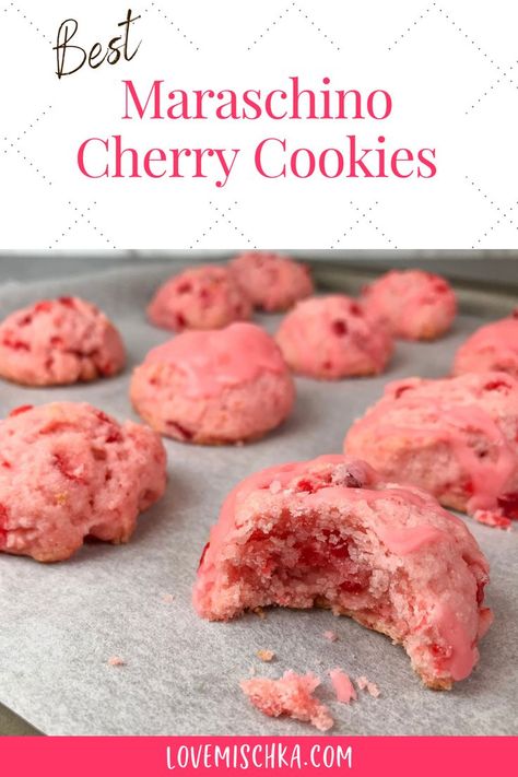 Pink cherry cookies on parchment paper. The closest one has a bite taken out of it to reveal bright red pieces of maraschino cherry and a moist, soft center. Cheery Cherry Cookies, Chewy Cherry Cookies, Cherry Wedding Cookies, Cherry Maraschino Cookies, Christmas Cookies With Maraschino Cherries, Glazed Cherry Recipes, Cherry Cake Cookies, What To Do With Maraschino Cherry Juice, Italian Cherry Cookies Recipes