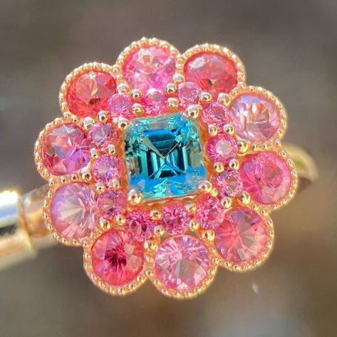 Discover the epitome of elegance with our Teal Tourmaline and Pink Spinel Halo Ring. Crafted in luxurious 14K gold, this stunning masterpiece showcases a mesmerizing teal tourmaline center encircled by a vibrant pink spinel halo. Elevate your style with this unique colored gemstone fusion - a timeless treasure for the sophisticated soul. 💍✨ This piece is sold, please do not order from this link. I put the listing here to showcase the design. Please message me if you are interested to customize Barbie Engagement Ring, Engagement Rings Pink, Bespoke Jewellery Design, Blue Engagement Ring, Pink Spinel, Engagement Ring Rose Gold, Pink Bling, Blue Tourmaline, Ring Rose Gold