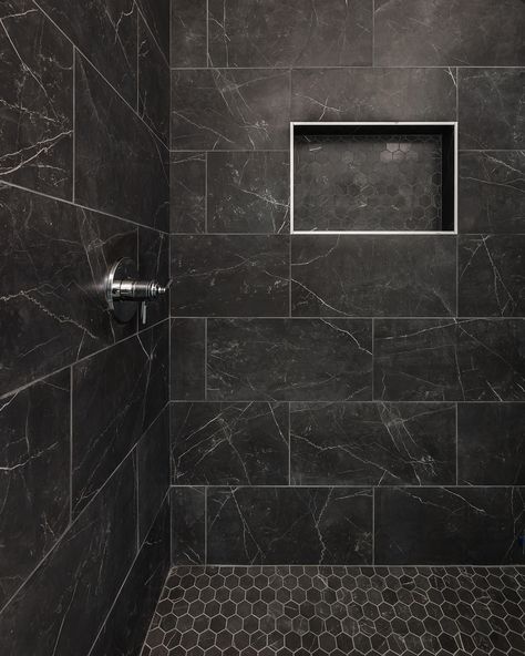 Bold, beautiful, and timeless: these black-tiled showers truly make a statement! Whether you choose a glossy or matte finish, black tiles create a stunning backdrop that complements any design.  Builder: @restorebuildanddesign  Design: @hawkinsandgraydesign  Photos: @lyndseymariephotography Best Shower Tile Ideas, Black Showers Bathroom, Dark Bathroom Accent Wall, Matte Black Shower Tile, Black Tile Shower Wall, Black Shower Ideas, Dark Grey Shower Tile, Shower Tile Ideas Walk In, Dark Shower Tile Ideas