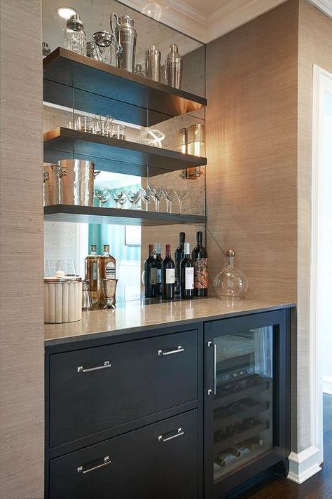 Chic butler's pantry boasts a nook filled with grey cabinets fitted with a glass-front beverage fridge placed under grey floating shelves lining a mirrored backsplash. Bar Nook, Bar In Casa, Bar Mini, Modern Home Bar, Home Bar Design, Built In Bar, Decor Ikea, Home Bar Designs, Mini Bars