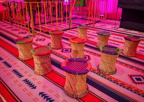 Punjabi style seating plan - Cane ottoman with customised cushions over the designer carpet Punjabi Theme Decoration, Cane Ottoman, Mayra Decor, Indian Destination Wedding, Designer Carpet, Punjabi Style, Seating Plan, Indian Wedding Decorations, Carpet Design