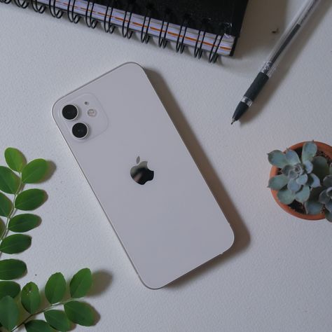 iPhone 12 white on table with plants Iphone 12 Mini White Aesthetic, Iphone 12 Aesthetic White, White Iphone 11 Aesthetic, Iphone 11 Aesthetic Phone, White Iphone Aesthetic, Iphone 12 Pro White, Iphone 12 Aesthetic, Iphone 12 White, Iphone 11 Aesthetic