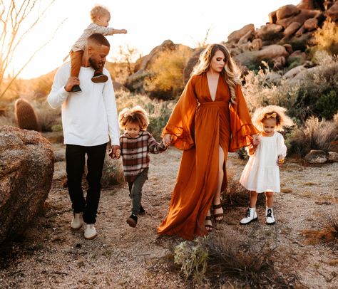 Rust Orange Fall Family Pictures, Rustic Family Photoshoot Outfit, Boho Style Family Photoshoot, Long Dress Family Pictures, Long Dress For Fall Family Pictures, Fall Desert Photoshoot Family, Desert Family Portraits, Rust Orange Family Pictures, Boho Chic Family Photoshoot