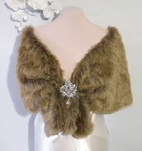 Wedding cape light brown fox , Faux fox fur shawl,Bridal cape ,Faux Fur Cape This elegant faux fur capelet  with brooch was designed for that special day or evening wedding. The design of this capelet is elbow length.  (Measures Approx 20" , Will Fit Up To 55 inch circumference (Fits Small -Plus size)  Since every garment is created  for you -  For best accurate results, measure as indicated in the picture yourself& compare with the detailed size chart below: X-Small       37 in           small Fur Capelet, Brown Shawl, Faux Fur Cape, Hollywood Costume, Fur Cape, Wedding Cape, Bridal Cape, Fur Shawl, Medieval Fashion