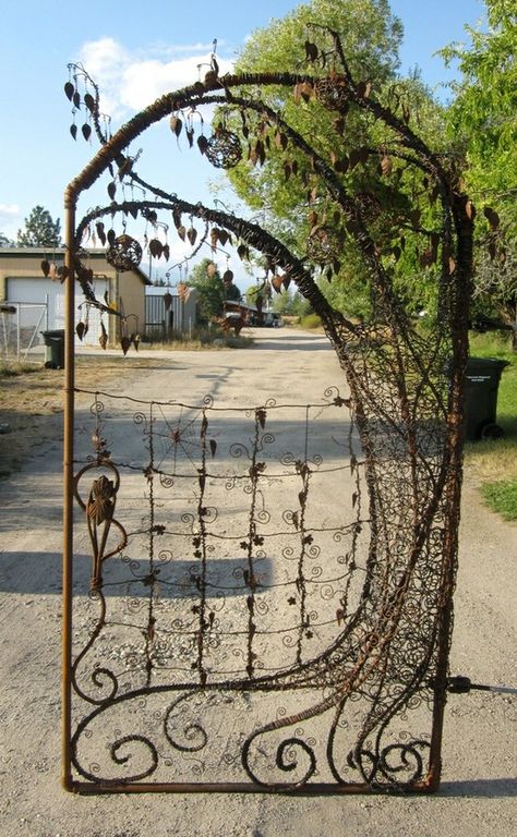 Unique garden gate using metal pipe, re bar, old fencing, barbed wire, metal table legs, rusty tin cans and vintage chandelier crystals | gardenpins.comgardenpins.com Rusty Tin, Chandelier Crystals, Tin Cans, Metal Table Legs, Iron Gates, Fence Gate, Unique Gardens, Garden Gate, Metal Pipe