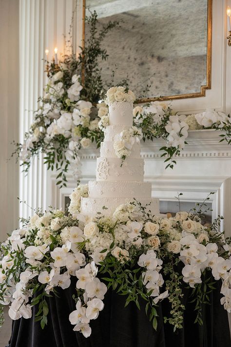 This Gorgeous cake display was at The Mason The stunning cake is designed by Dallas Affairs Bakery and of course the flowers are by us! Photo by V G Photography #wedding #weddingcake #weddingdesign #weddingdesign #weddingflowers #wildroseevents #weddingfireplace #weddingreception Wedding Cake Display Table Elegant, Cake Table Florals, Cake Table Wedding Decorations, Flower Cake Table, Floral Cake Table, Vintage Cake Table, Cake Table Flowers, Wedding Cake Tables, Wedding Cake Table Decor