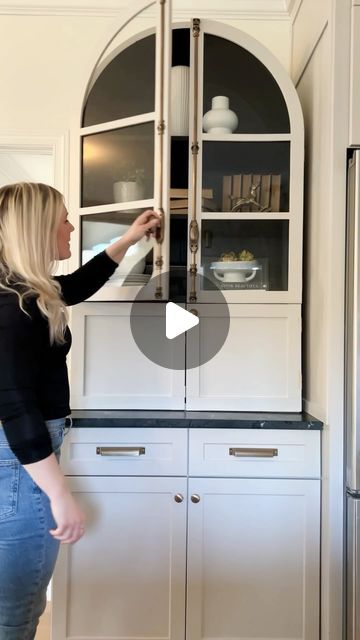 Aubrey + Laura on Instagram: "✨Arched cabinet reveal✨ I used an arched cabinet from World Market, cut it down to size, painted it, and here.she.is 😍 Oh and I added my dream brass cremone bolts plus two of the cutest brass knobs 🥳 🏷️: kitchen renovation, kitchen cabinet hardware, DIY kitchen, arched cabinet, painted cabinets" Arched Upper Cabinets, White Arched Kitchen Cabinets, Kitchen Arched Cabinet Doors, Arched Kitchen Cabinets, Are Arched Kitchen Cabinet Doors Dated, Arch Glass Cabinet Doors, Arched Cabinets, Cremone Bolt Cabinet, Cremone Bolt