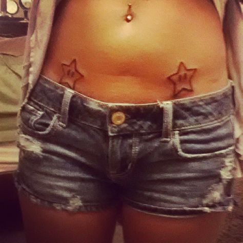 Super Mario Stars tattooed on hips Super Star Tattoo, Super Mario Sunshine Tattoo, Mario Star Tattoo Design, Super Mario Star Tattoo, Mario Star Y2k, Hip Stars Tattoo, Mario Star Tattoo, Mario Star, Waist Tattoos