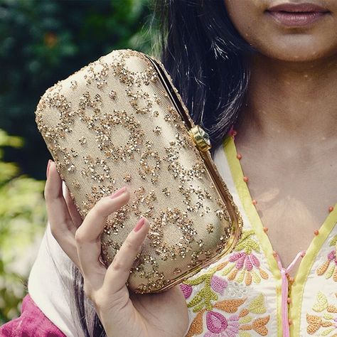 This beautiful all Gold clutch with Gold glitter design is a perfect combination for those glamorous rush evenings highlighting your attire with a dash of gold. Chic for the glam quotient and sparkly for the traditional wears fitting the dual occasions perfectly. Comes with detachable golden chain & round clasp to keep your essentials perfectly in place. Shine in Gold!! #rusaru #clutch #clutches #gold #shine #sparkle #glam #trendy #chic #indian #wedding #trousseau #fashion #designer #ilovebags Golden Clutch Purses, Indian Wedding Trousseau, Formal Bags, Fancy Clutch Purse, Golden Clutch, Fancy Clutch, Formal Bag, Wedding Trousseau, Bridal Mehendi Designs Hands