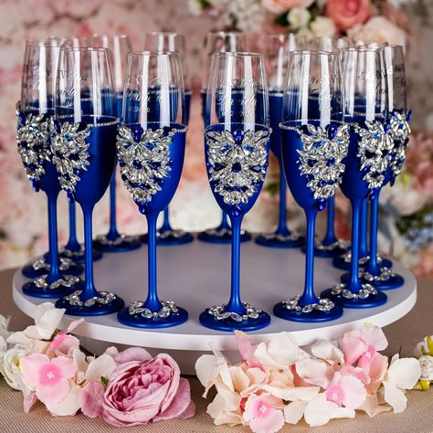 Make Your Quinceañera Celebration unique with Royal Blue Champagne Bottle and 4 Glasses Set - Ready to Be Filled with Joy, Best Quince Memories, and New Beginnings! Raise a toast to your journey to adulthood with a beautifully personalized Champagne Bottle and 4 Glasses, customized just for You. Set includes:~ bottle (empty) ~ 4 glasses.All the items are hand-made.Can be personalized with name and date of your celebration.We can decorate this set with any color or text you want. Blue Quince Ideas Themes, Royal Blue Champagne Glasses, Royal Blue Quinceanera Butterfly Theme, Sweet 15 Party Ideas Quinceanera Blue, Royal Blue Quinceanera Decorations Ideas, Royal Blue Quinceanera Theme Ideas, Royal Quinceanera Theme, Royal Blue Quinceanera Ideas, Blue Silver Quinceanera