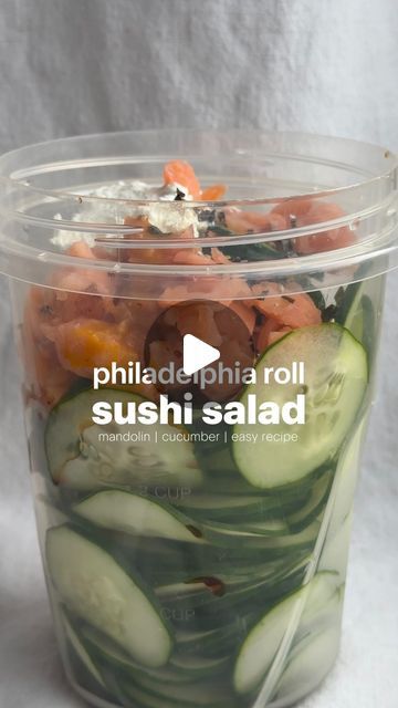 Erin Silberman on Instagram: "Philadelphia Roll Sushi Salad   •Follow @seriousfoodfetish for more recipes, restaurant recs & food trends•  There’s a creator named @logansfewd who has been making this thinly sliced cucumber salad almost every day in a container & changes out the flavors. I couldn’t get it out of my head, so I had to make my own & it’s so incredibly easy since you use a mandolin. Will be making this again tomorrow!   Ingredients  •1 cucumber •smoked salmon, chopped •2-3 T cream cheese  •1 T light soy sauce  •1 T ginger salad dressing  •furikake seasoning   Recipe 1. Use a mandolin to slice a whole cucumber into a container.  2. Add salmon, soy sauce, dressing, cream cheese, & furikake. Shake until well combined.  3. Serve in a bowl with more furikake on top. Enjoy!" Cucumber Sushi Salad, California Roll Cucumber Salad, Furikake Seasoning Recipe, Philadelphia Roll, Ginger Salad Dressing, Soy Sauce Dressing, Ginger Salad, Sushi Salad, Cucumber Sushi