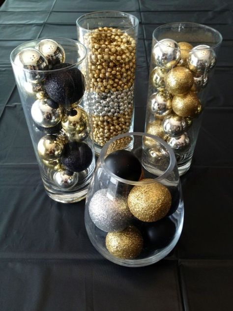 Gold, black, and silver Christmas ornaments in glass cylinders Great Gatsby Party Decorations, Gatsby Party Decorations, Silver Christmas Ornaments, Gatsby Themed Party, Gatsby Theme, 50th Anniversary Party, Great Gatsby Wedding, Great Gatsby Party, Gold Christmas Decorations