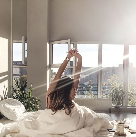 Rear View Of Young Woman With Arms Raised Sitting On Bed At Home Create A Morning Routine, Vision Board Images, How To Stop Snoring, A Morning Routine, Vision Board Pictures, Productive Morning, Healthy Morning Routine, Healthy Routine, When You Sleep