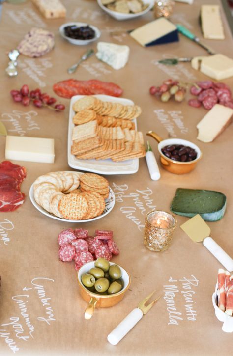 cheese board on kraft paper Kraft Paper Food Table, Butcher Paper Tablecloth Party, Butcher Paper Party Decor, Charcuterie Board Ideas On Brown Paper, Wine And Cheese Party Decor, Table Runner Charcuterie Board, Craft Paper Buffet Table, Craft Paper Charcuterie Table, Charcuterie Board Ideas Butcher Paper