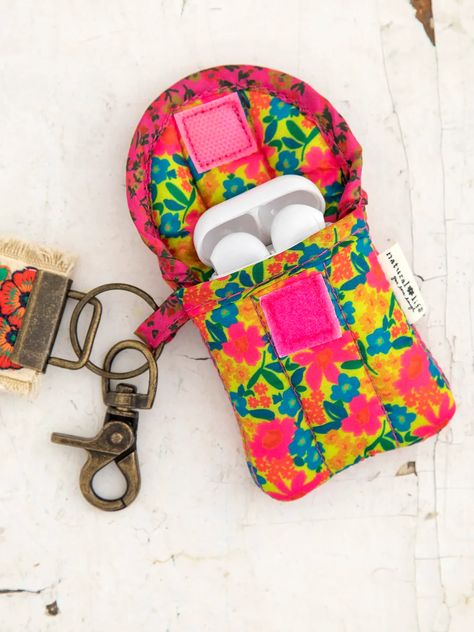 This nylon, quilted Ear Bud Vase holds your Headphones or Air Pods! The velcro closure keeps them secure. Its bright colored print makes it easy to find when it's deep in your bag, or use the little hook so it can attach to anything! Keychain Hook, Ear Bud, Earbud Case, Cute Stockings, Prayer Box, Boho Bags, Pink Neon, Easter Shopping, Natural Life