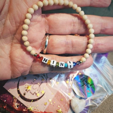 Just mailed this custom bracelet. She ordered from my website the "Custom Word Alphabet Bracelet", chose creamy fossil jasper beads, her word (NINI), and then emailed me to request the colors of the chakras. So cute, right? Get yours here: https://www.breathebyjosie.com/products/custim-word-alphabet-bracelet (Yes, I spelled "custom" wrong when I created the listing 😬) Alphabet Bracelet, The Chakras, Custom Bracelet, Jasper Beads, Custom Bracelets, My Website, Fossil, Chakra, So Cute