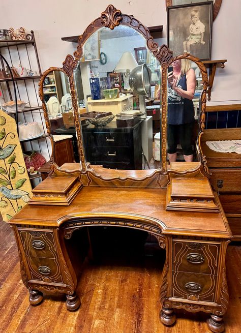 Beautiful 1920's antique Art Deco Neo Classical vanity with triple mirror and vanity chair.  Four deep drawers, dovetail construction with original brass hardware, the drawers have a slight bombay curve to them with wood molding all around.  Two jewelry boxes on top.  Bun feet, lots of carving, embellishments and beautiful detail.  46 x 18 x 27 and vanity chair measures 26 x 16 x 18 x 24".  Matching armoire and dresser available.   Very good original condition.   Free shipping to the West Coast, Old Hollywood Vanity Aesthetic, Antique Vanity Desk, 1920s Dressing Room, Medieval Vanity, Thrifted Vanity, Wooden Vanity Bedroom, 2000s Furniture, Funky Vanity, Antique Makeup Vanity