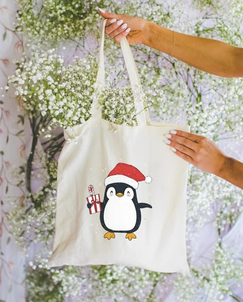 Penguin Christmas Tote Bag, Cute Penguin with Balloon, Holiday Gift Shopper, Eco Friendly Bag, Penguin Lover Gift, Xmas Tote, Bag for Life by ToteTale on Etsy Christmas Tote Bag Ideas, Bag Painting, Penguin Christmas, Christmas Tote Bags, Bags Ideas, Christmas Tote, Cute Penguin, Eco Friendly Bags, Diy Tote Bag