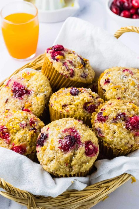 Whip up a batch of Cranberry Orange Muffins in under 30 minutes for a quick, simple treat that perfectly blends tart cranberries with sweet, citrusy orange. These moist muffins come alive with warm spices, making them a bright and festive addition to any holiday spread. Orange Muffins Healthy, Christmas Eve Brunch, Casserole Side Dishes, Cranberry Orange Muffins, Moist Muffins, Orange Muffins, Homemade Muffins, Frozen Cranberries, Recipes Appetizers And Snacks