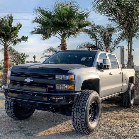 Up for sale is a stunning 2015 Chevrolet Silverado 2500HD LML Turbo diesel truck with professionally done modifications. It will perfectly handle towing, hauling, long road trips, desert trails and look awesome while doing all of that. Badass custom black front-end. Read more! #chevy #silverado #diesel #duramax #liftedtrucks Custom Silverado, Chevy Duramax, Truck Games, Silverado Truck, Trucks Lifted Diesel, Chevrolet Silverado 2500hd, Money Pit, Duramax Diesel, Truck Mods