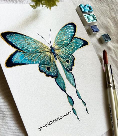 Butterfly love! 💙🦋💙 . . Original Sold!! . . . . . . | Instagram Moth Watercolor Painting, Metalic Painting Art, Colorful Art Inspiration, Watercolor Butterfly Painting, Lisilinka Watercolors, Water Colour Butterfly, Metallic Watercolor Painting Ideas, Metallic Watercolor Painting, Skrim Watercolors