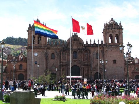 Cuzco and Peru flag in public square Peru Flag, Gap Year Travel, City Flags, Altitude Sickness, Public Square, Andes Mountains, Gap Year, Rainbow Design, Sea Level