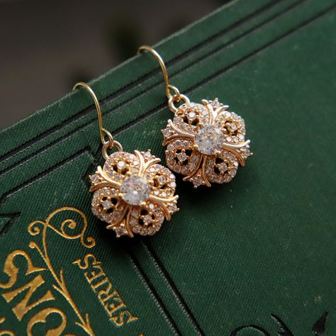 Beautifully sparkly 18k gold plated dangle and drop earrings in a Regency / Victorian style with perfectly shaped round faceted cubic zirconia stones. The drops measure 1.5cm (0.6") in length. Perfect wear for any occasion or to give as a special, thoughtful gift. Your earrings will arrive to you in gift box ready to give or to treat yourself. These earrings are perfect for a bride or bridesmaids for a classic or vintage themed wedding. If you would like a larger quantity, please DM us or email 1930 Jewelry, Victorian Gold Earrings, Handwritten Gift Tags, Regency Jewelry, Art Nouveau Earrings, Faberge Jewelry, Art Nouveau Earring, Victorian Earrings, Diamond Dangle Earrings